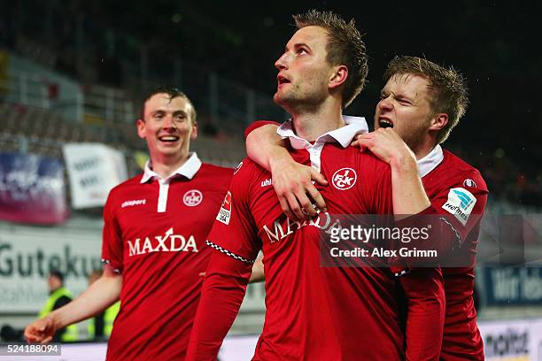 Kacper Przybylko of Kaiserslautern celebrates his team's first goal with team mates Jean Zimmer and Jon Dadi Bodvarsson during the Second Bundesliga...