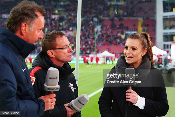 Sport1 TV presenter Laura Wontorra talks to Head coach Ralf Rangnick of Leipzig and Peter Neururer during the Second Bundesliga match between 1. FC...
