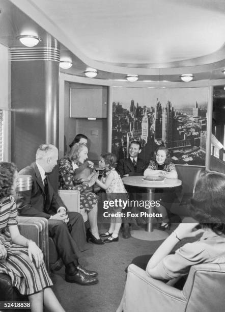 Passengers in the observation car on the new streamlined 20th Century Limited, circa 1930. This famous luxury train, the work of industrial designer...