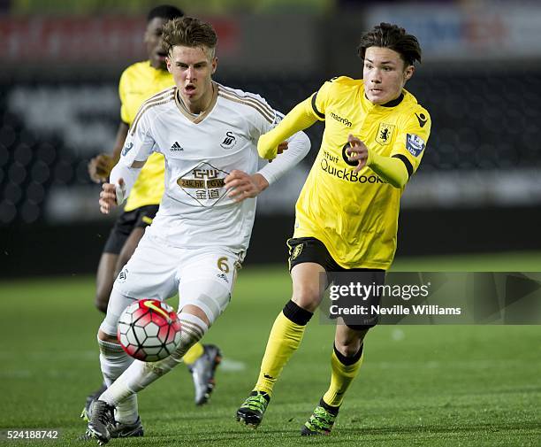 Callum O'Hare of Aston Villa is challenged by Joe Rodon of Swansea City during the U21 Barclays Premier League match between Swansea City and Aston...