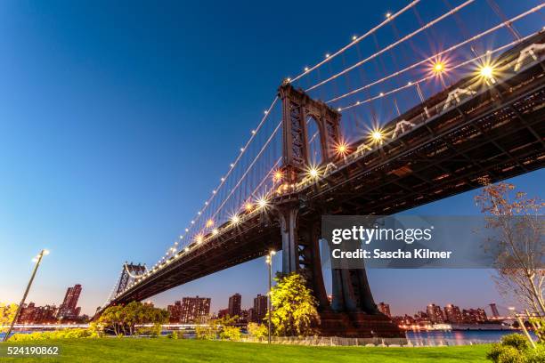 low angle view of the manhattan bridge - dumbo new york stock pictures, royalty-free photos & images