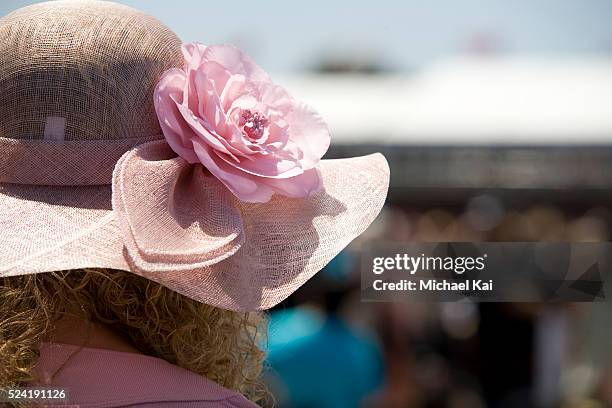 Race fan with a pretty hat at the Melbourne Cup. The Melbourne Cup Horse Racing is Australia's major annual thoroughbred horse race. The Melbourne...