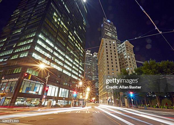 downtown atlanta illuminated at night - atlanta streets stock pictures, royalty-free photos & images