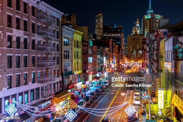 high angle view of street in china town, new york city - chinatown stock pictures, royalty-free photos & images