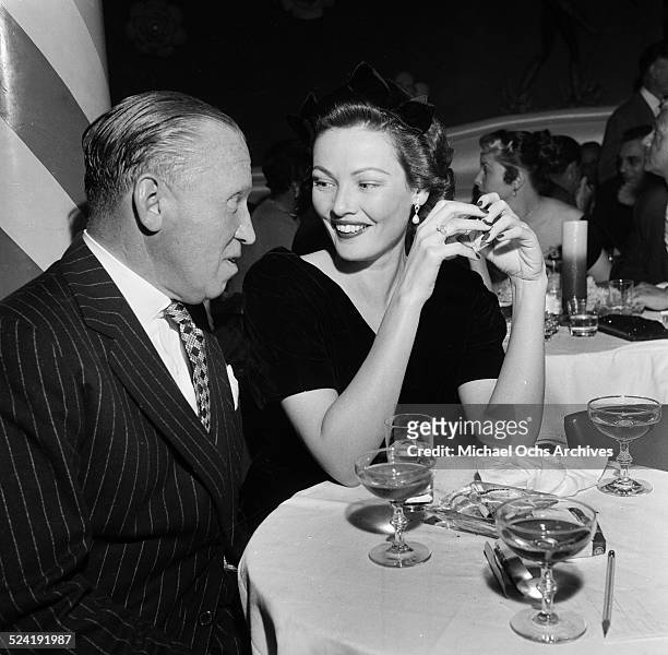 Actress Gene Tierney and guest attend the premiere party for "Red Garters" in Los Angeles,CA.