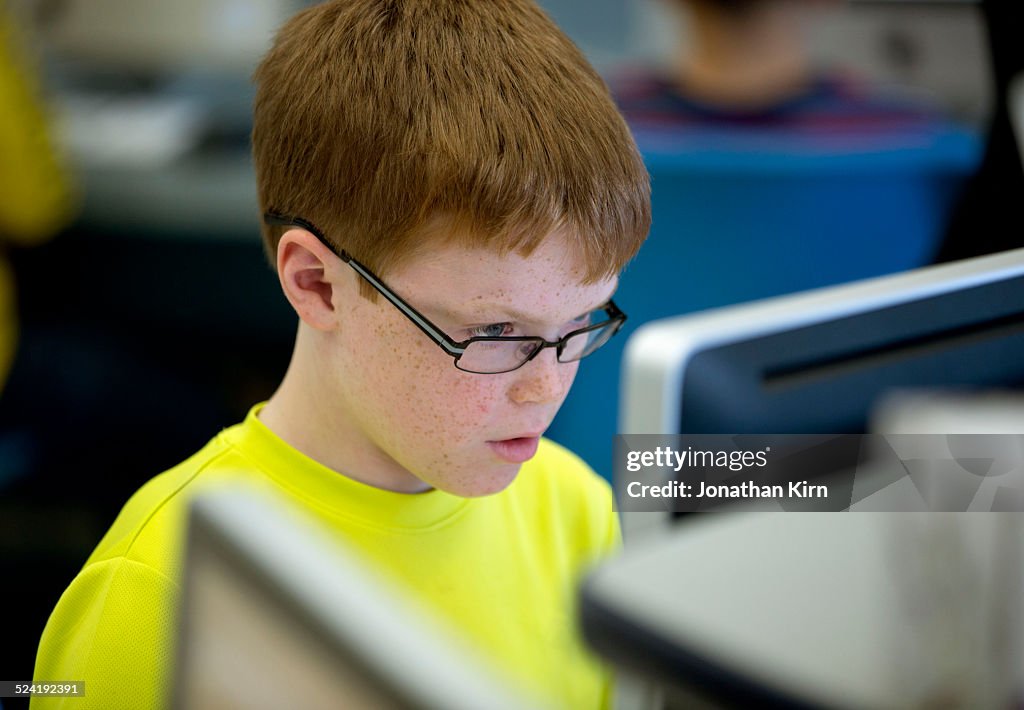 Sixth grader in computer lab at school