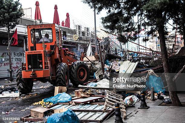 Barricades are cleared away as police fought to retake Istanbul's Taksim Square, firing tear gas and water cannon at demonstrators on June 11 the...