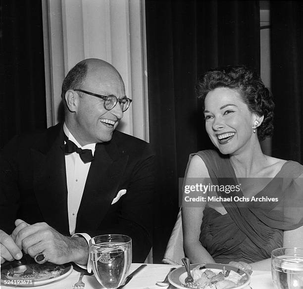 Actress Gene Tierney and escort attend the Humanitarian Awards in Los Angeles,CA.