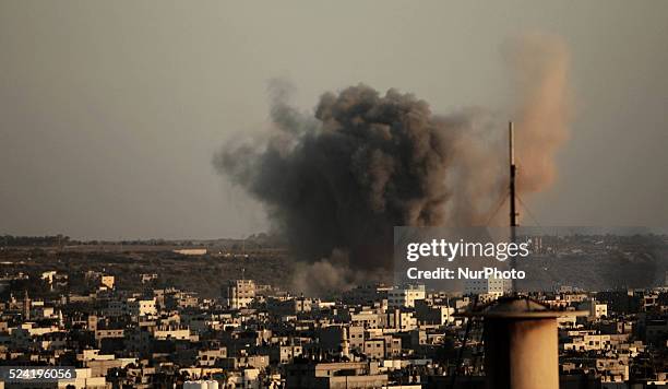 Smoke rises following what witnesses said was an Israeli air strike in Gaza August 20, 2014. Arab League chief Nabil al-Arabi accuses Israel of...