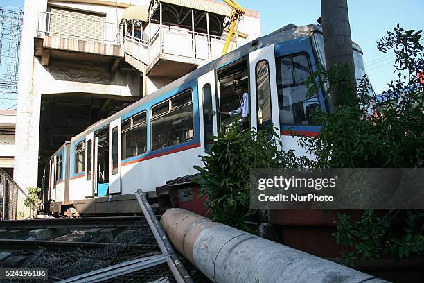 Security guard of the Metro Rail transit system guards the entrance of the main coach of the 3 coach train that slammed on the stop barrier at the...