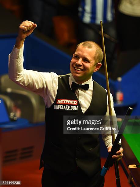 Barry Hawkins of England celebrates victory in his second round match against Ronnie O'Sullivan of England on day ten of the World Snooker...
