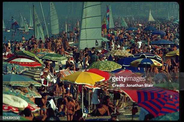 Crowds of tourists on the beach in Rimini, Italy.