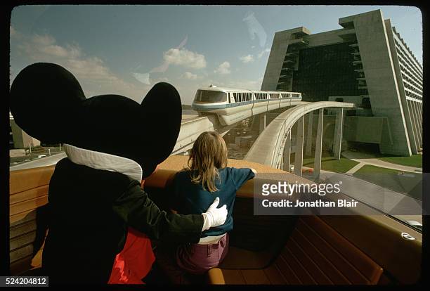 Girl and Mickey Mouse on Monorail