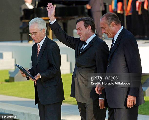 German Chancellor Gerhard Schroeder waves while walking with French President Jacques Chirac at the end of the Franco-German ceremony held at the...