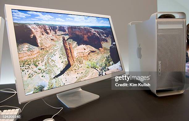 Apple Computer Inc. Introduced a new 30-inch flat panel display, shown here with a G5 computer, and demonstrated the latest version of its Mac OS X...