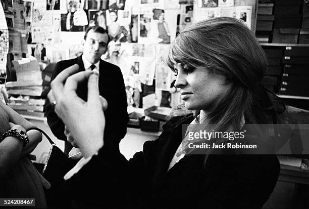 Close-up of American actress Julie Christie as she shops in an unidentified boutique, New York, New York, January 1966.