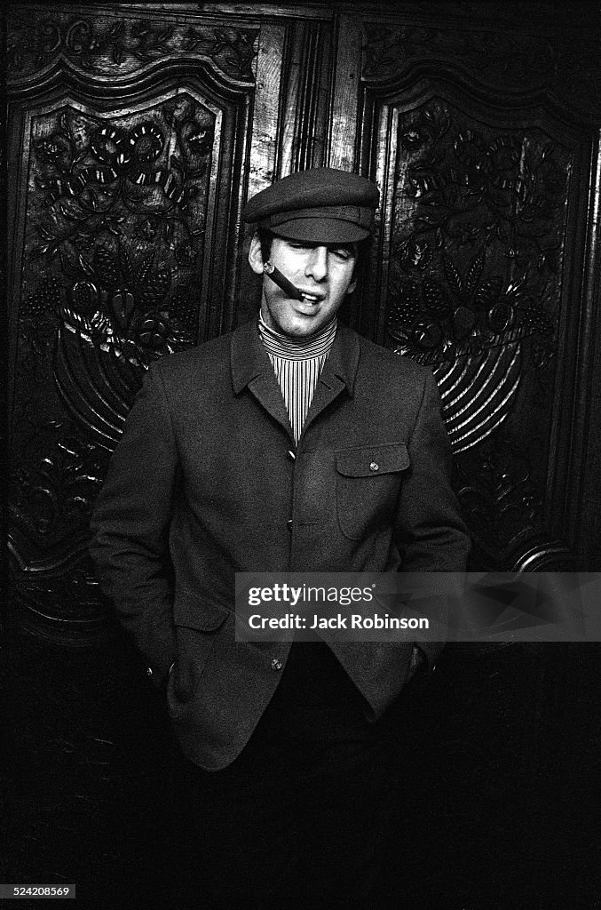 Portrait of American actor Elliott Gould as he poses, hands in his ...