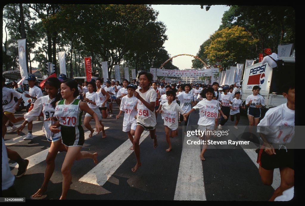 Barefoot Marathon Runners Dash Across Starting Line