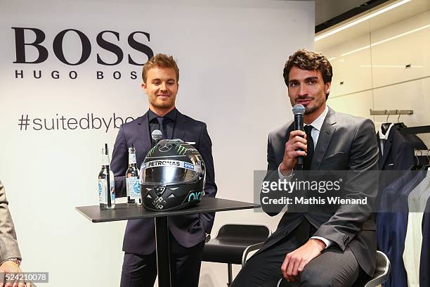 Nico Rosberg and Mats Hummels attend the Hugo Boss Store Event on April 25, 2016 in Duesseldorf, Germany.
