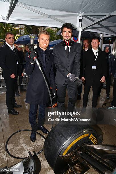 Nico Rosberg and Mats Hummels attend the Hugo Boss Store Event on April 25, 2016 in Duesseldorf, Germany.