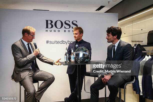 Florian Koenig, Nico Rosberg, Mats Hummels attend the Hugo Boss Store Event on April 25, 2016 in Duesseldorf, Germany.