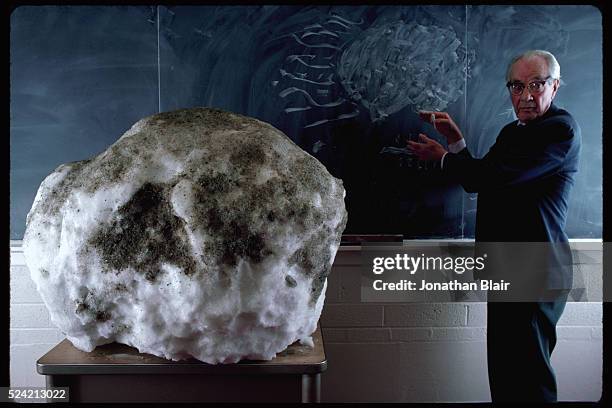 Dr. Fred Whipple uses a 500 pound snowball covered with dirt in his Harvard classroom to demonstrate the anatomy of a comet's nucleus. | Location:...