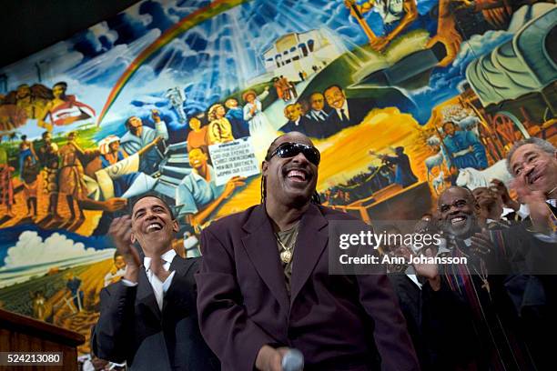 Illinois Senator Barack Obama, a Democratic candidate for the office of President of the United States, left, is joined by a singing Steve Wonder...