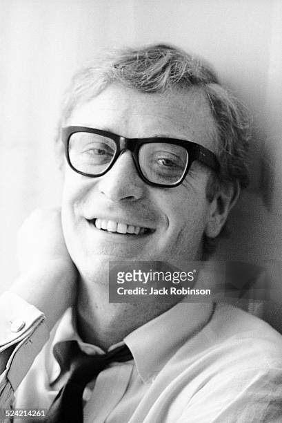 Portrait of British actor Michael Caine as he poses in an apartment, New York, New York, December 1966.