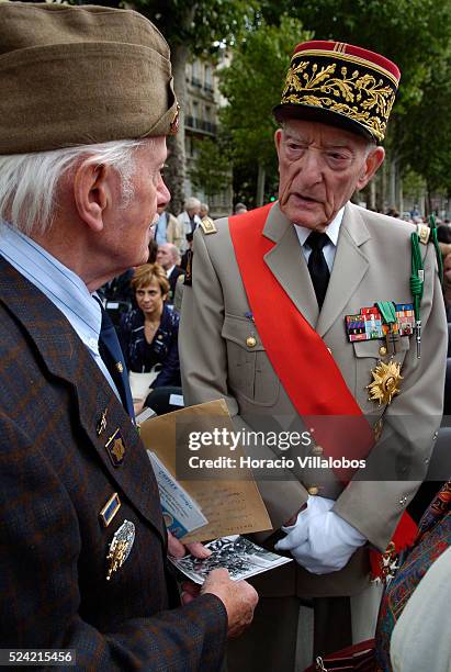 French General Alain de Boissieu, son in law of Charles De Gaulle, chats with a veteran at the first homage to Republican Spanish combatants who...