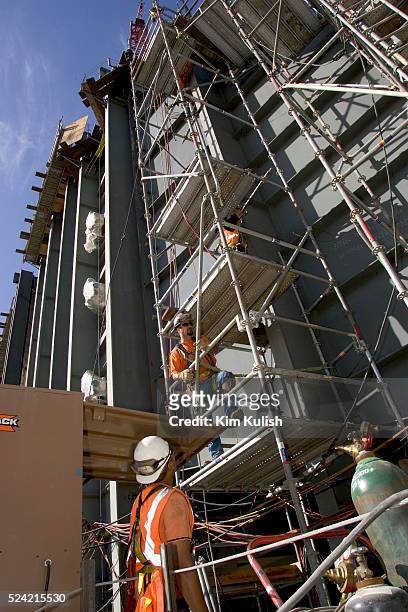 Workers are seen at the Calpine, 600 MW Metcalf Energy Center under construction in San Jose, California.