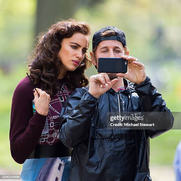Model Irina Shayk and photographer Steven Klein are seen during a photoshoot in Central Park on April 25, 2016 in New York City.