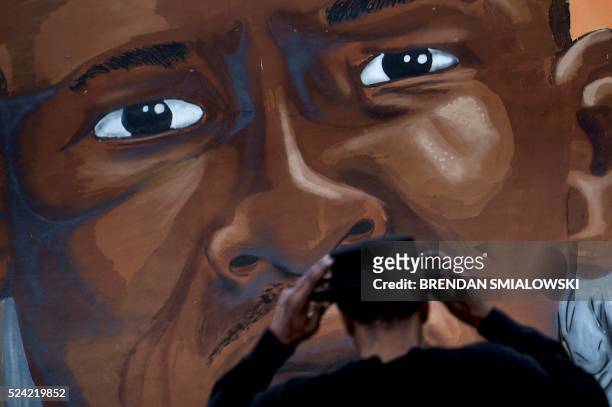 Mural dedicated to Freddie Gray is seen April 25, 2016 in Baltimore, Maryland, a year after the protests that were sparked by Gray's death in police...