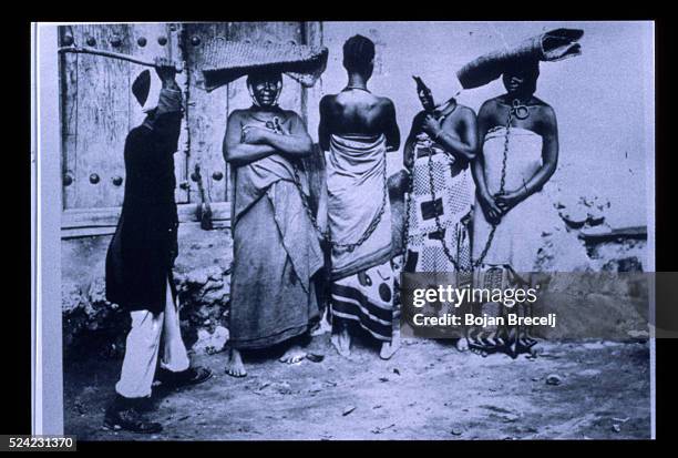 Slaves in chains on the island of Zanzibar in the 19th century. Slavery was abolished in March 5, 1873. Within twenty four hours the main slave...