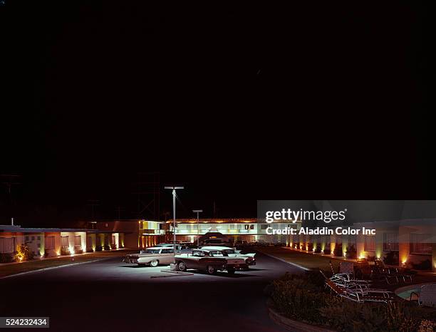 Nighttime view of cars parked in the lot at Empey's Desert Villa, a hotel in Las Vegas which eventually became the Barbary Coast.