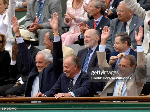 King Juan Carlos of Spain smiles, while Paris Mayor Bertrand Delanoe and the French Tennis Federation president, Christian Bimes join in the Mexican...