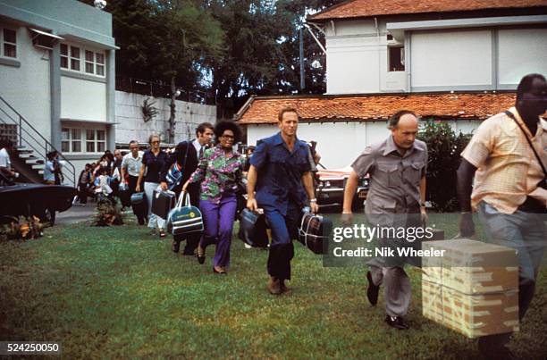 Civilian evacuees board US Marine helicopter inside US Embassy compound to be helilifted to the US Seventh Fleet ahead of Communist troops about to...