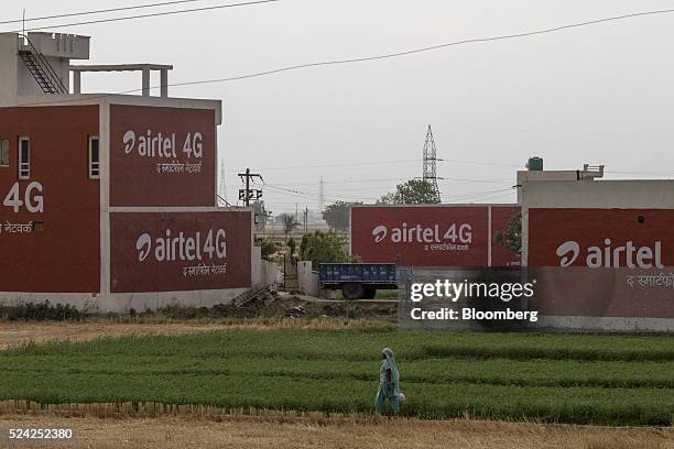 Painted advertisements for Bharti Airtel Ltd. Are displayed on the sides of buildings in Murthal, Haryana, India, on Friday, April 22, 2016. Bharti,...