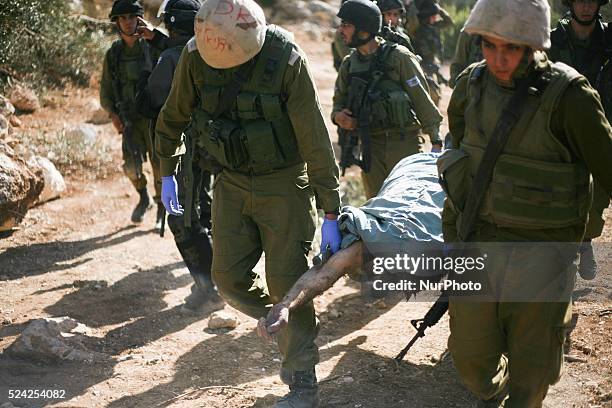 Israeli troops kill a Palestinian "Mohammed Assi" during clashes in the village of Bil'in near the West Bank city of Ramallah October 22, 2013....