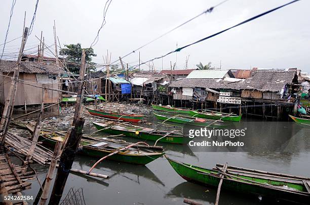 Fishing boats remain docked along a fishing village in Bacoor, south of Manila, Philippines, November 8, 2013. Thousands of people living in coastal...
