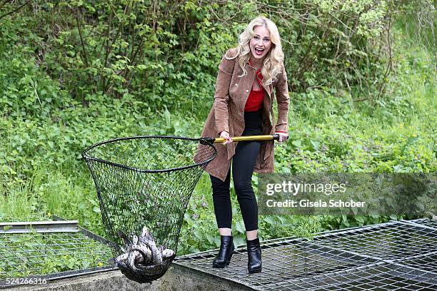 Donau - Testimonial Silvia Schneider fishes living trouts during the 'Genuss am Fluss' cooking event at Hotel 'Donauschlinge Schloegen' on April 25,...