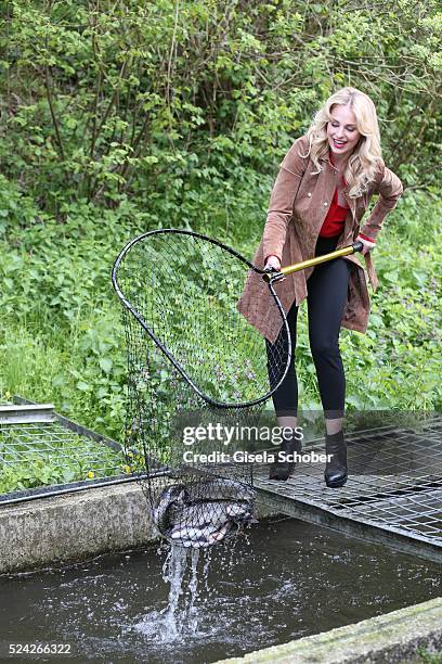 Donau - Testimonial Silvia Schneider fishes living trouts during the 'Genuss am Fluss' cooking event at Hotel 'Donauschlinge Schloegen' on April 25,...