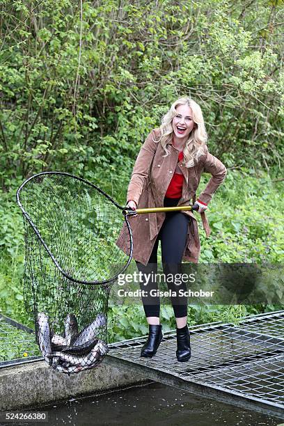 Donau - Testimonial Silvia Schneider fishes living trouts during the 'Genuss am Fluss' cooking event at Hotel 'Donauschlinge Schloegen' on April 25,...