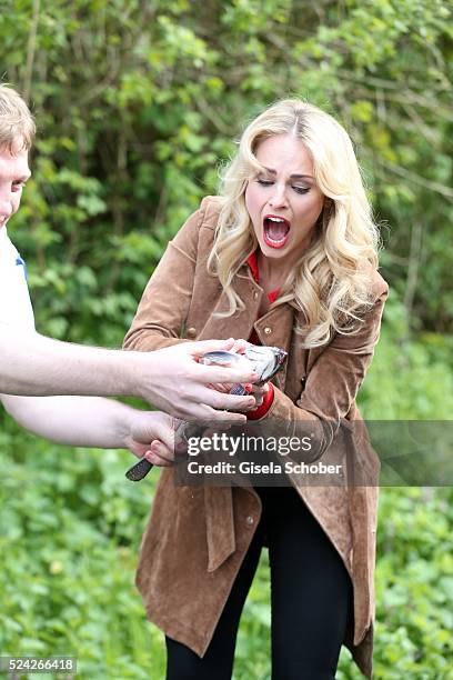 Alois Grufeneder gives Donau - Testimonial Silvia Schneider a living trout during the 'Genuss am Fluss' cooking event at Hotel 'Donauschlinge...