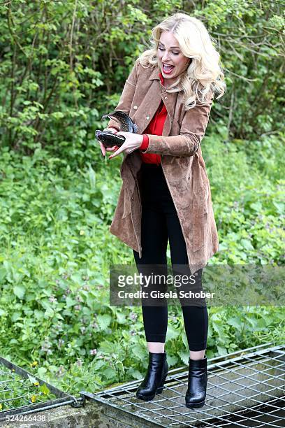 Donau - Testimonial Silvia Schneider with a living trout during the 'Genuss am Fluss' cooking event at Hotel 'Donauschlinge Schloegen' on April 25,...