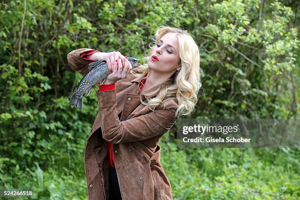 Donau - Testimonial Silvia Schneider with a living trout during the 'Genuss am Fluss' cooking event at Hotel 'Donauschlinge Schloegen' on April 25,...