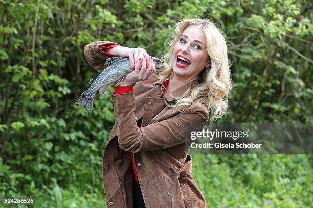 Donau - Testimonial Silvia Schneider with a living trout during the 'Genuss am Fluss' cooking event at Hotel 'Donauschlinge Schloegen' on April 25,...