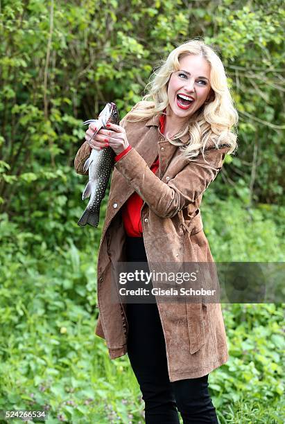 Donau - Testimonial Silvia Schneider with a living trout during the 'Genuss am Fluss' cooking event at Hotel 'Donauschlinge Schloegen' on April 25,...