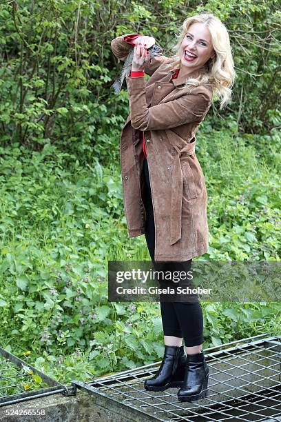 Donau - Testimonial Silvia Schneider with a living trout during the 'Genuss am Fluss' cooking event at Hotel 'Donauschlinge Schloegen' on April 25,...