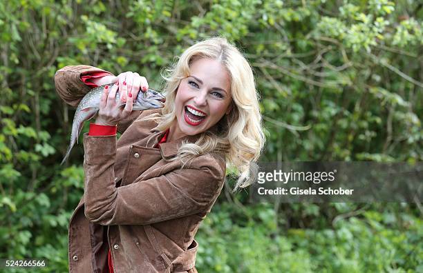 Donau - Testimonial Silvia Schneider with a living trout during the 'Genuss am Fluss' cooking event at Hotel 'Donauschlinge Schloegen' on April 25,...