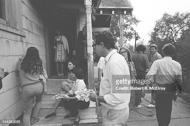 Crowds from the New York Film Festival mill about outside the USCO Group's studios, formerly a church, and have refreshments, during an USCO group...